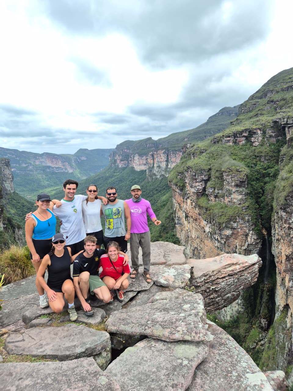 Hikers trekking through Pati Valley with mountain views in Chapada Diamantina